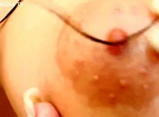 nicky baby SHOWS her oiled natural TITS in close-up.