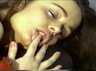 Sexy girl in nylon stockings strips and uses strapon