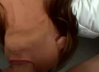 Pretty babe engages in oral play with a cock