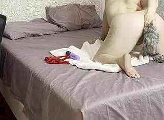 chubby cindy wong teases with tail plug for anal fun