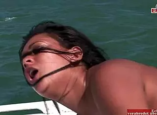 Busty black babe drilled on boat in wild anal threesome