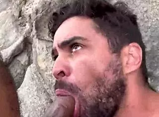 Guys fucking bareback on the beach in outdoor scene