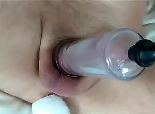 Hairless guy pumps his dick while a tail is in his ass