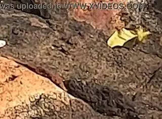 beautiful young girl watched having public sex on beach rocks interrupted by third person