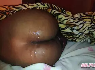 Watch the lover lick this Angolan ebony's shaved pussy until cumshot.