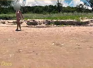 Wife plays football nude at public clothed beach for daring fun