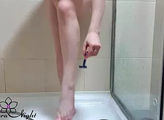 Blonde teen feels intense pleasure jerking off in wet bathroom