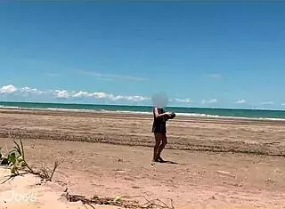 Wife plays football nude at public clothed beach for daring fun