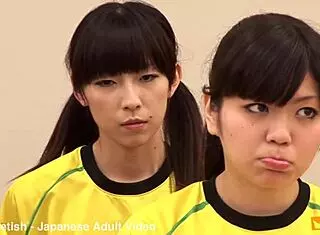 japanese female team listens and takes a lesson from their coach. cute brunette babe in costumes follows instructions closely