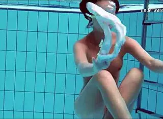 Hot European babe shows tits and shaved pussy underwater
