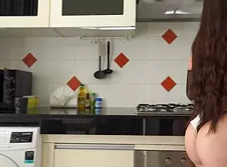 Brunette slave bent over washing dishes while taking rough cock