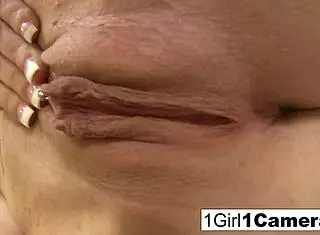 Sexy Cristien plays with her camera, masturbating her pussy and tits in close up