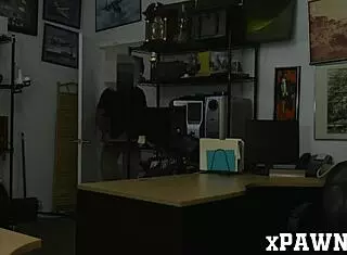 this pretty lady bent over in the pawnshop office, giving a hidden blowjob to a monster cock