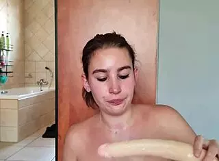 Gathering saliva while fucking throat with double dildo repeatedly