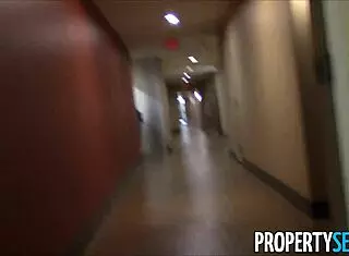 young real estate agent shows property outdoors