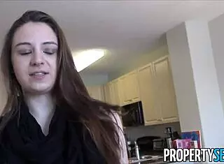 young real estate agent shows property outdoors