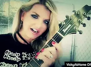 Hot blonde Vicky Vette rubs her wet pussy and big clit while giving a titjob with dirty talk