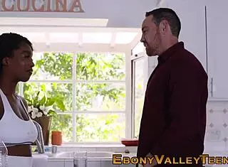 Busty black woman in a facial scene