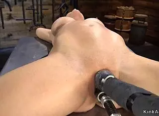 Busty Woman in Bondage Uses Machine for Pleasure
