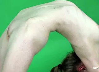 Young Brunette Gymnast Anna Mostik Spreads Legs in Naked Display.