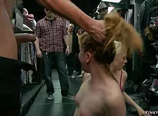 Blonde gets double penetration banged in a public sex shop.