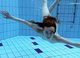 Anna Netrebko, tiny teen, swims underwater in a skimpy bikini at the beach