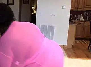 Saphire shows off her big black ass and tits in this german scene