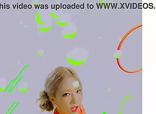 Loona twirls a hula hoop in an energetic performance.