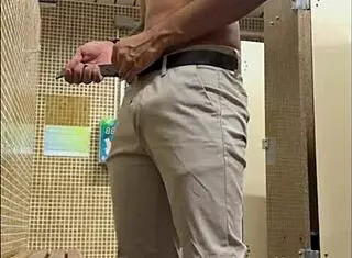 this muscular twink is showering in the gym, and i'm spying on his big cock