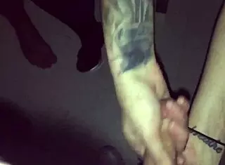 Tattoed goth chick casually sucks stranger's cock in video booth while cuckold watches
