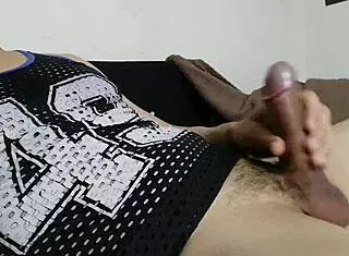 this guy at the party starts solo with his big cock, stroking hard in a web chat session