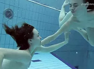 anna and lada relax in pool with bikinis on brunette beauties