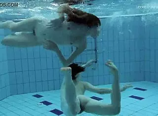 anna and lada relax in pool with bikinis on brunette beauties