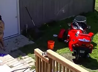 Inked Brunette Cleo Masturbates with Dildo in Garden for Neighbor