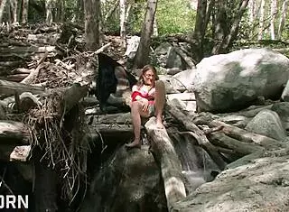 A sexy 18 yo girl feels pleasure masturbating in the forest.