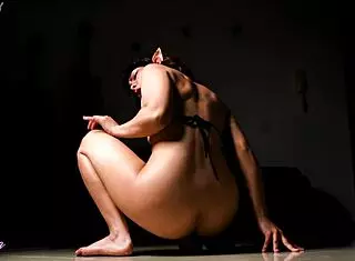 Young Latina Demonstrates Moves with Dildo