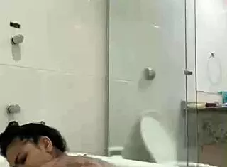 Hot brunette Bia masturbates with lubricating vaginal juices in the bathtub