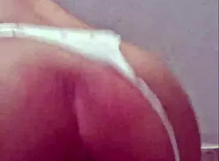 Brazilian babe shows her pussy swallowing a thick dildo.