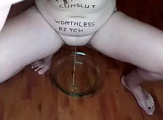 teen slut eating piss-soaked fruits with body writing