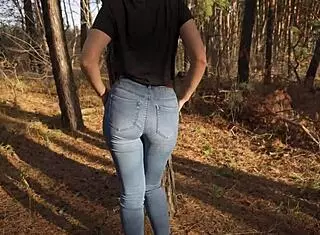 Hot milf teases her stunning ass in tight forest jeans