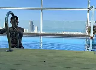 Young Couple Meets and Kisses at Swimming Pool