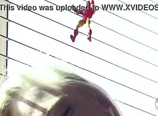 The giantess blonde casually plays with toys and balloons, dominating with her long legs in heels.