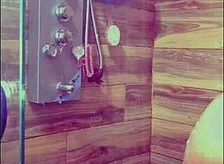 She gets hot and showers to orgasm