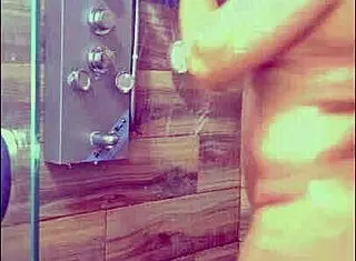 She gets hot and showers to orgasm