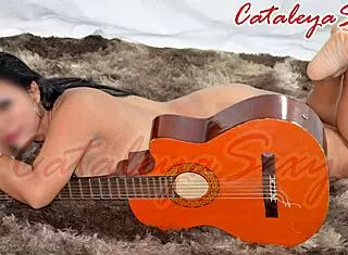 model says pose in outfits and naked with guitar, so sensual