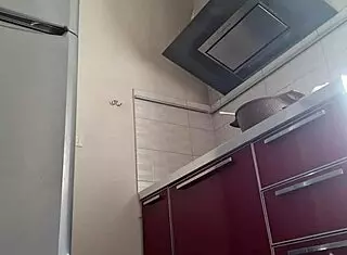 Gostosa cooking while teasing with natural tits