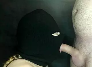 my step sister's hot mouth sucks cock under a hidden balaclava.